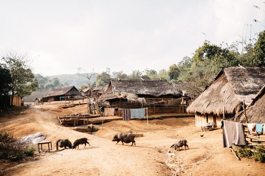 A Khamu village of wooden houses in the hills above the Mekong