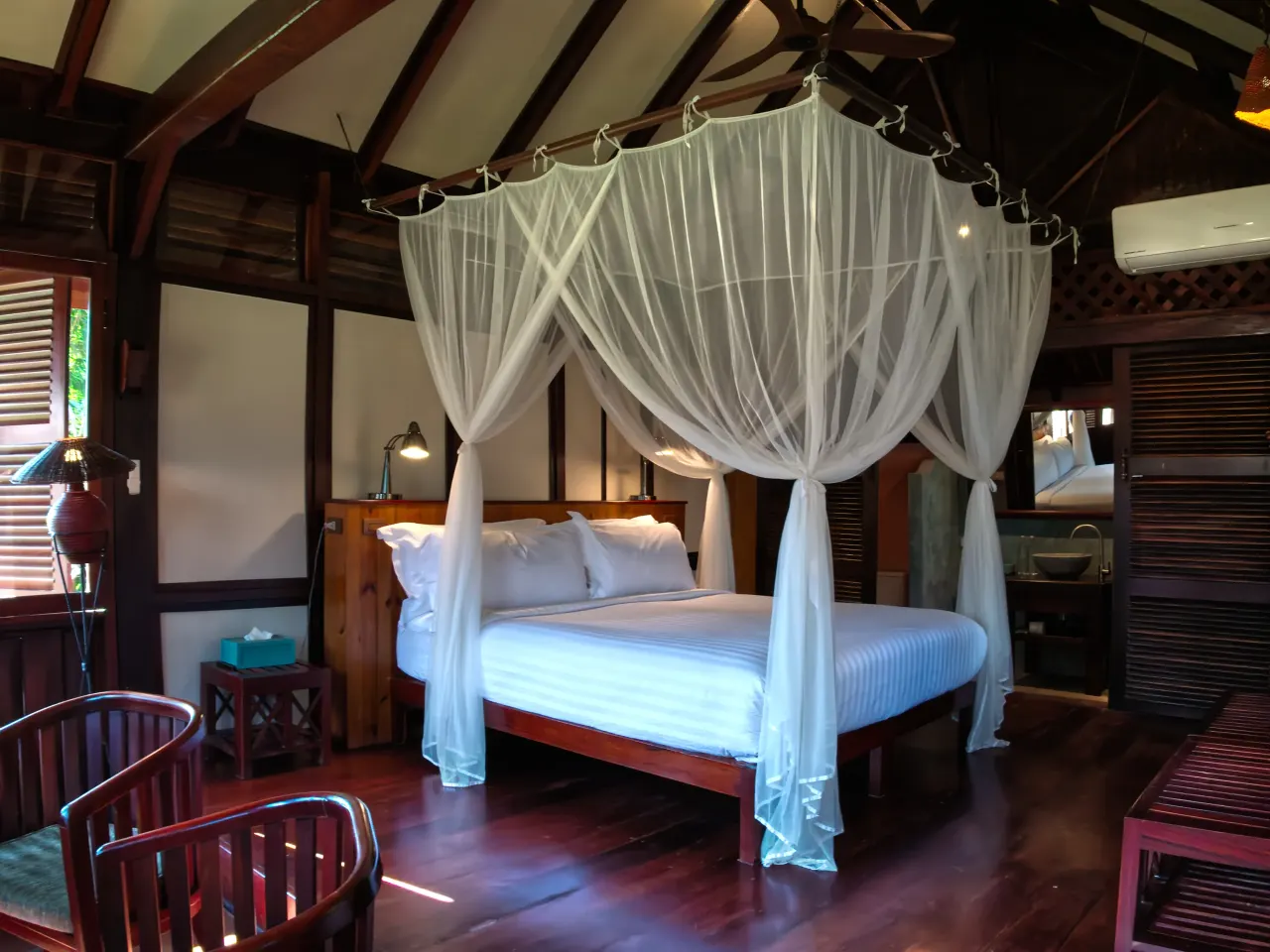Double bed with mosquito net in a Luang Say Lodge bungalow, Pakbeng, Laos